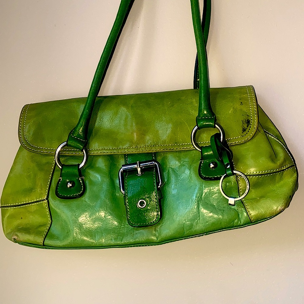 Hello this is a great purse. I love it. Just got to many.and a spot on it.